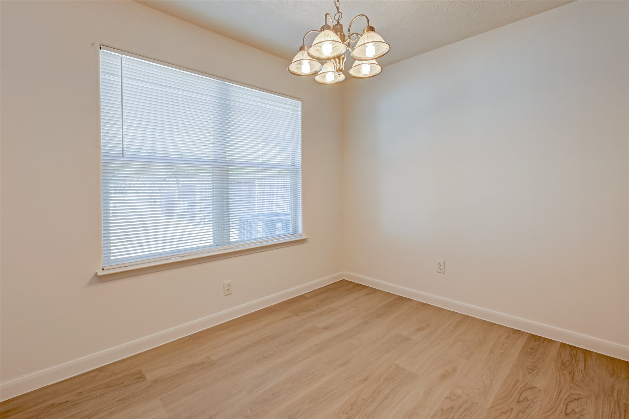 4830 Comal River Loop Spring, TX 77386 - Photo 20 of 43 an empty room with wooden floor and windows