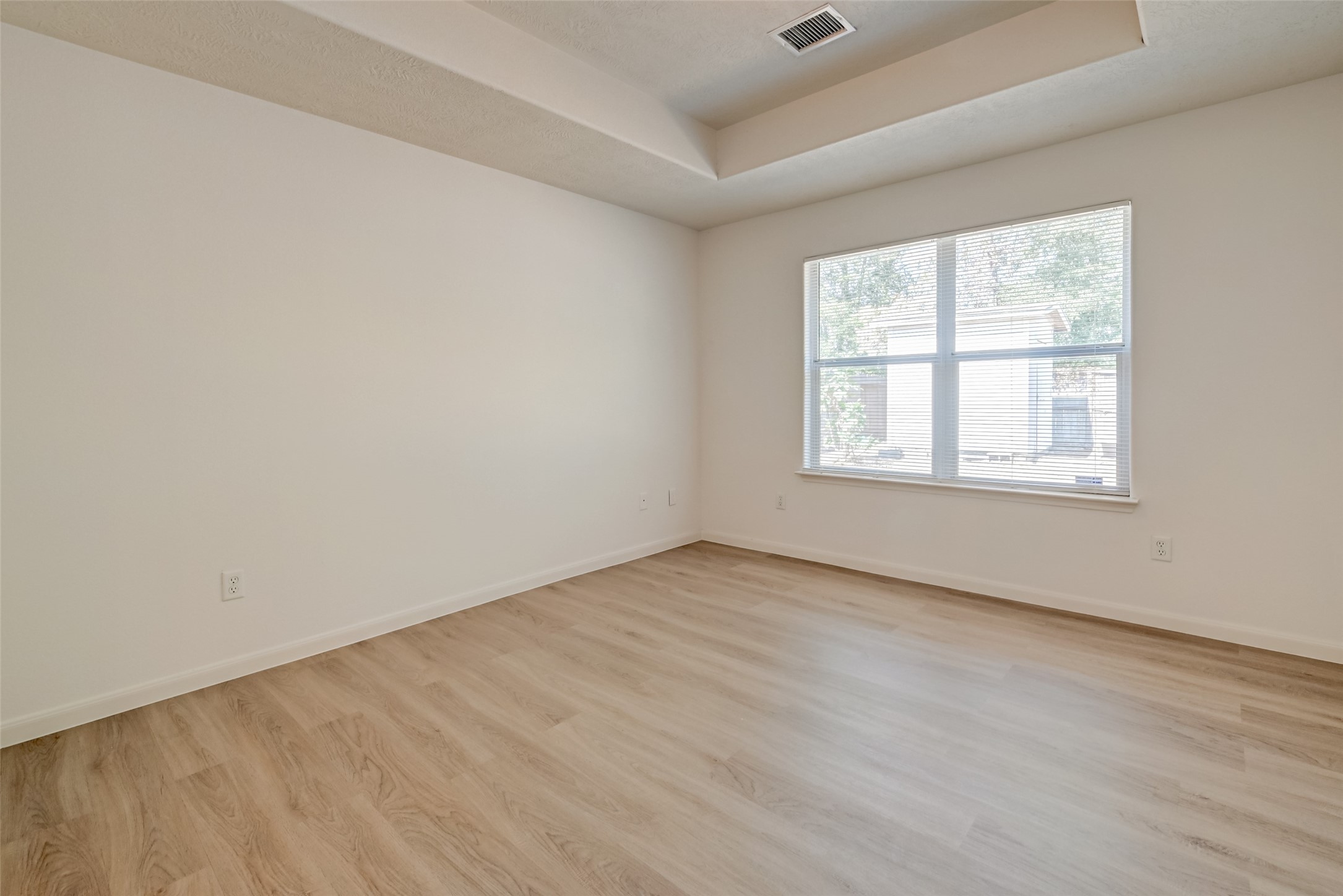 4830 Comal River Loop Spring, TX 77386 - Photo 28 of 43 an empty room with wooden floor and windows