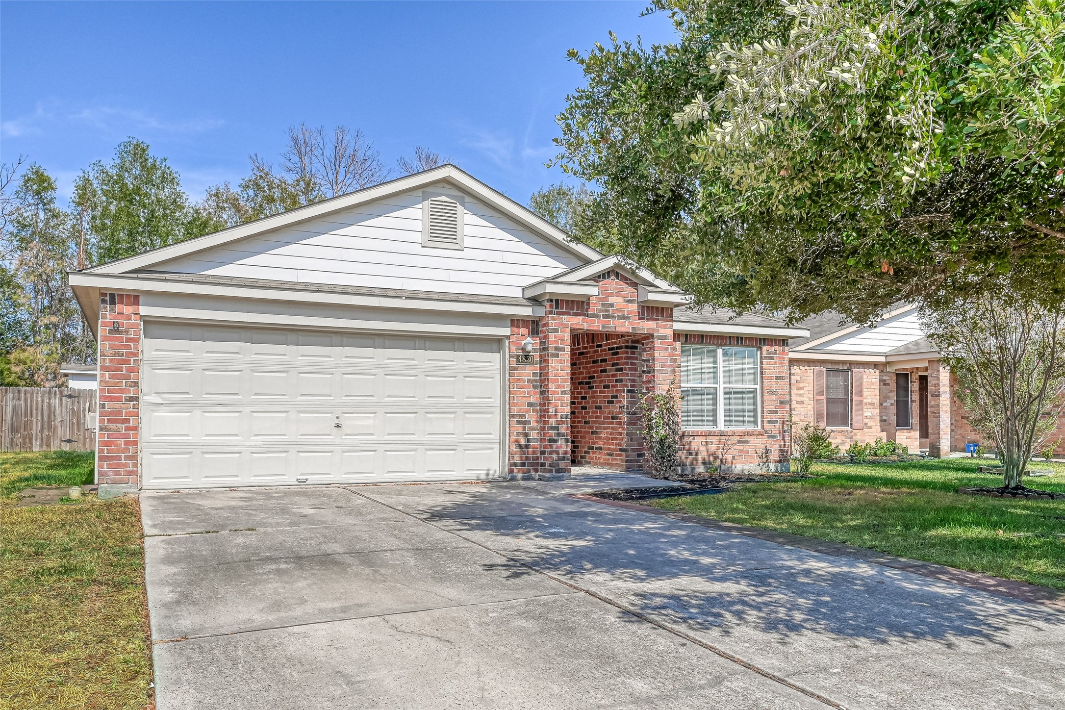 4830 Comal River Loop Spring, TX 77386 - Photo 3 of 43 a view of a house with a yard and large tree