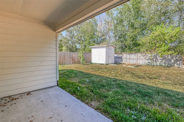 a view of a back yard of the house