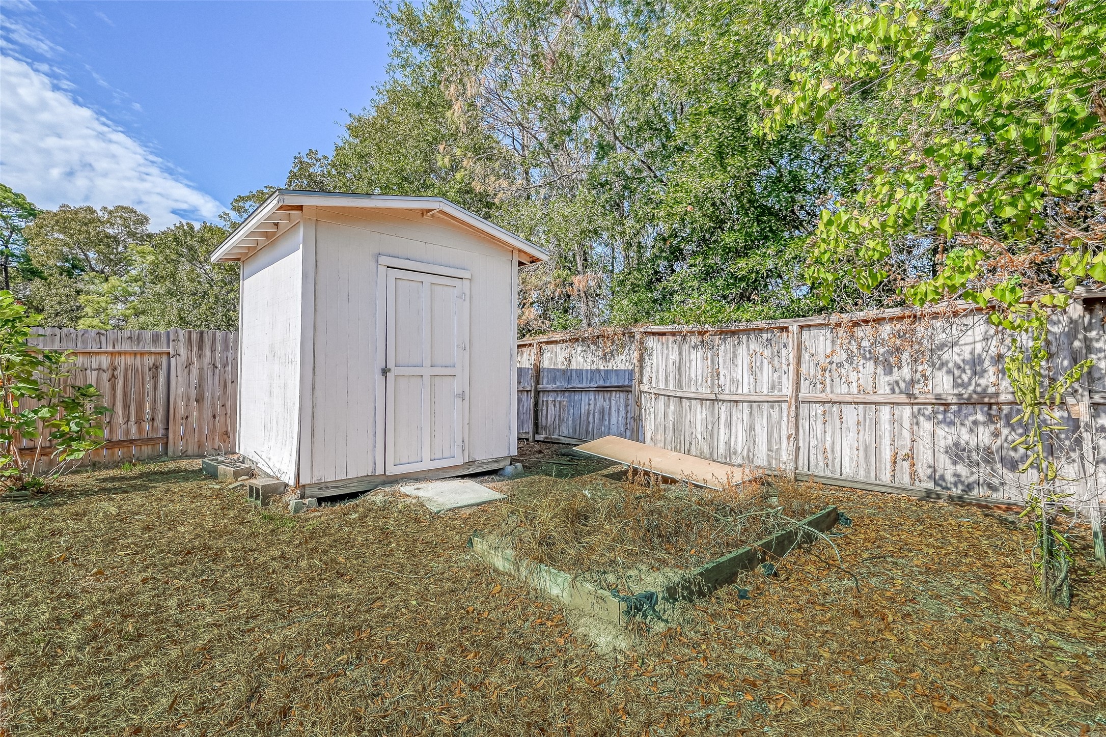 4830 Comal River Loop Spring, TX 77386 - Photo 41 of 43 a view of backyard with small cabin and wooden fence