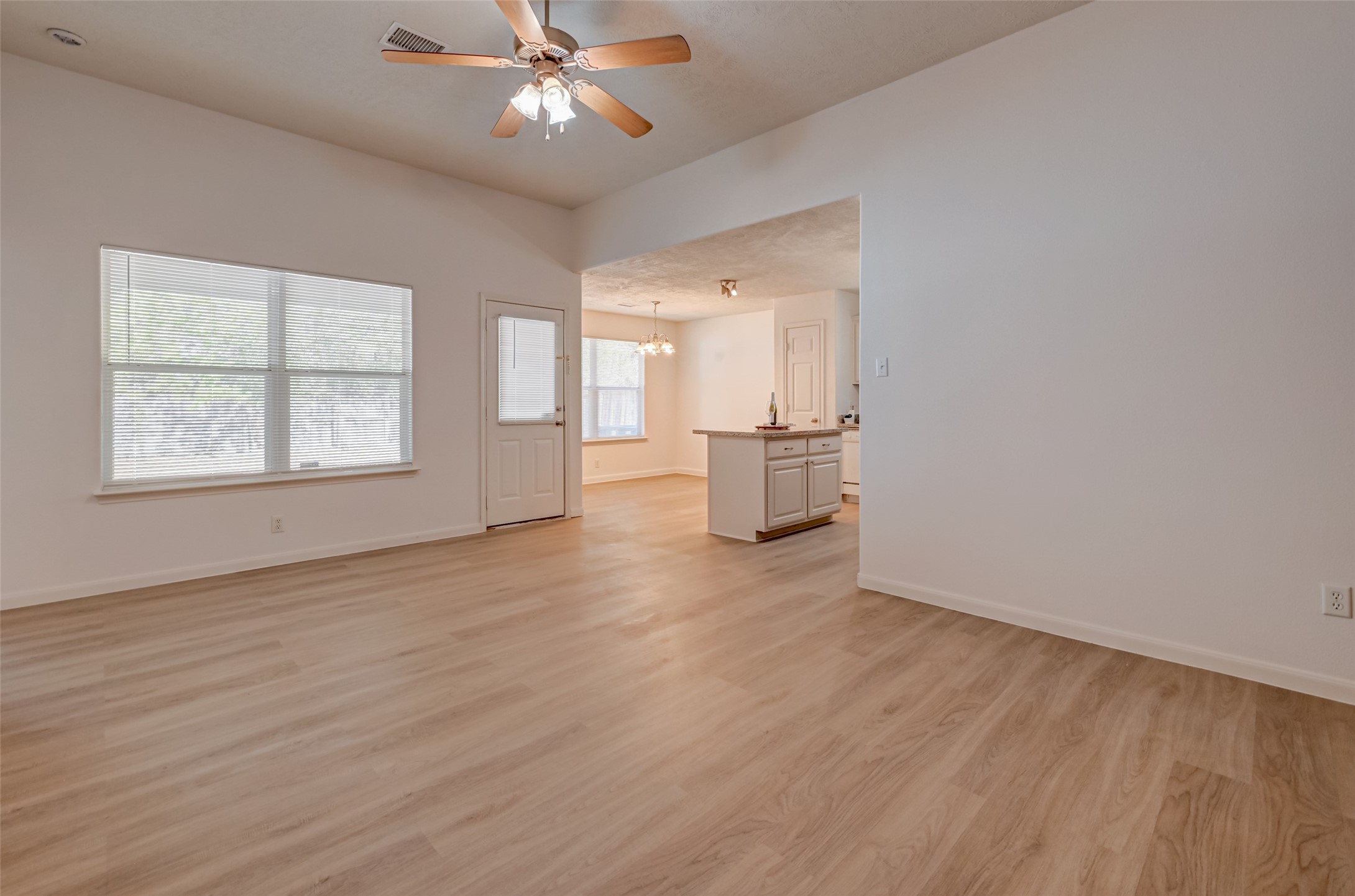 4830 Comal River Loop Spring, TX 77386 - Photo 10 of 43 a view of an empty room with a window and wooden floor