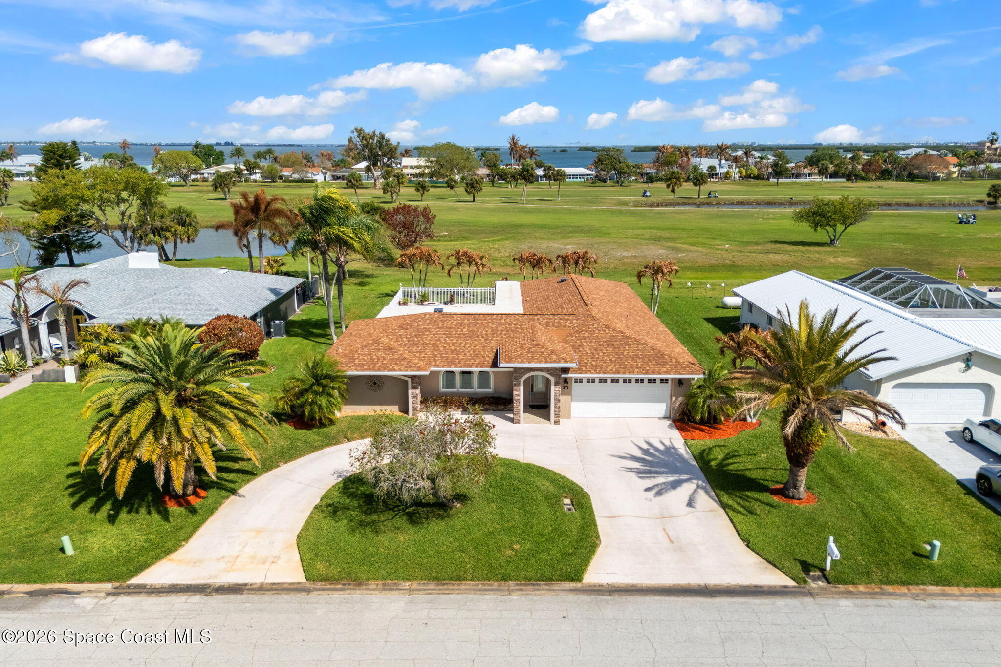 31 Fairway Drive Cocoa Beach, FL 32931 - Photo 1 of 53 a view of a swimming pool and outdoor space