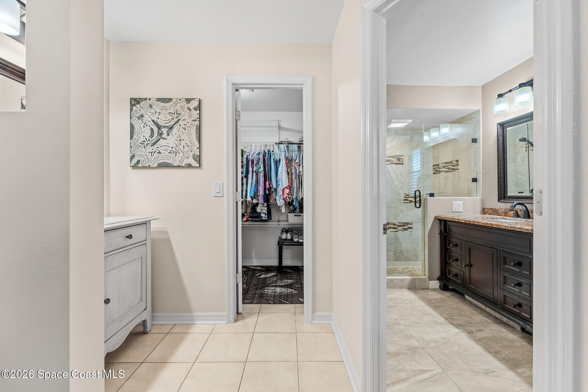 31 Fairway Drive Cocoa Beach, FL 32931 - Photo 15 of 53 a view of a hallway with cabinet and mirrors