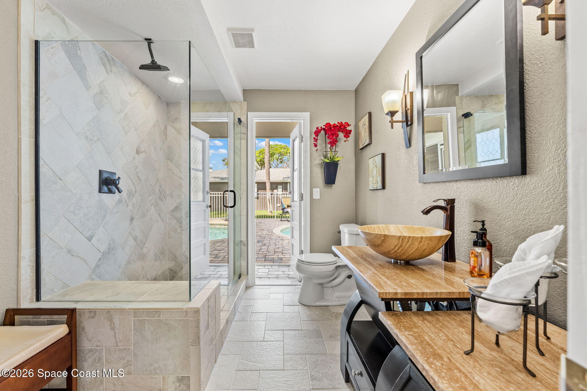 31 Fairway Drive Cocoa Beach, FL 32931 - Photo 21 of 53 a bathroom with a tub and shower