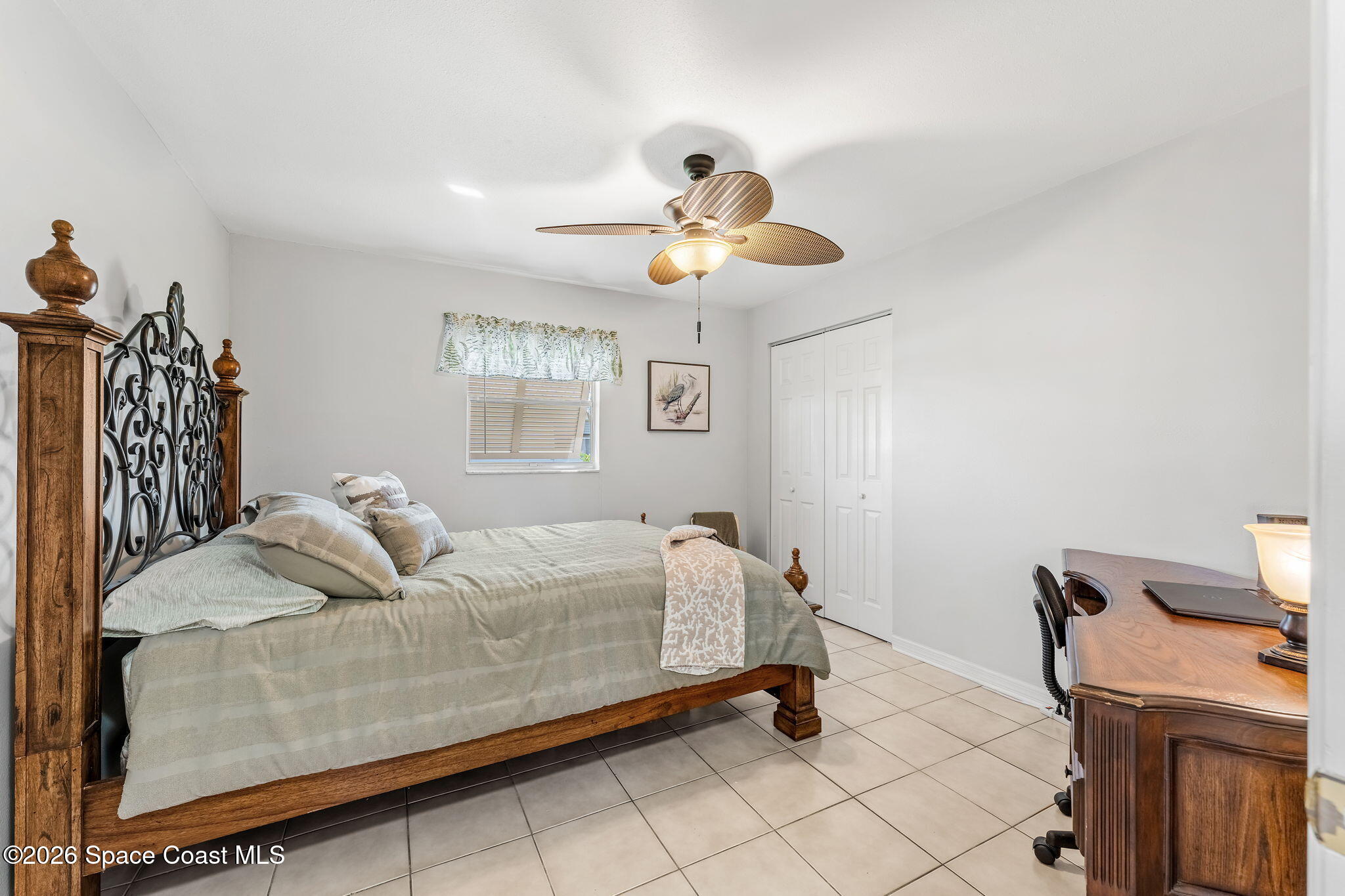 31 Fairway Drive Cocoa Beach, FL 32931 - Photo 23 of 53 a bedroom with furniture and a window