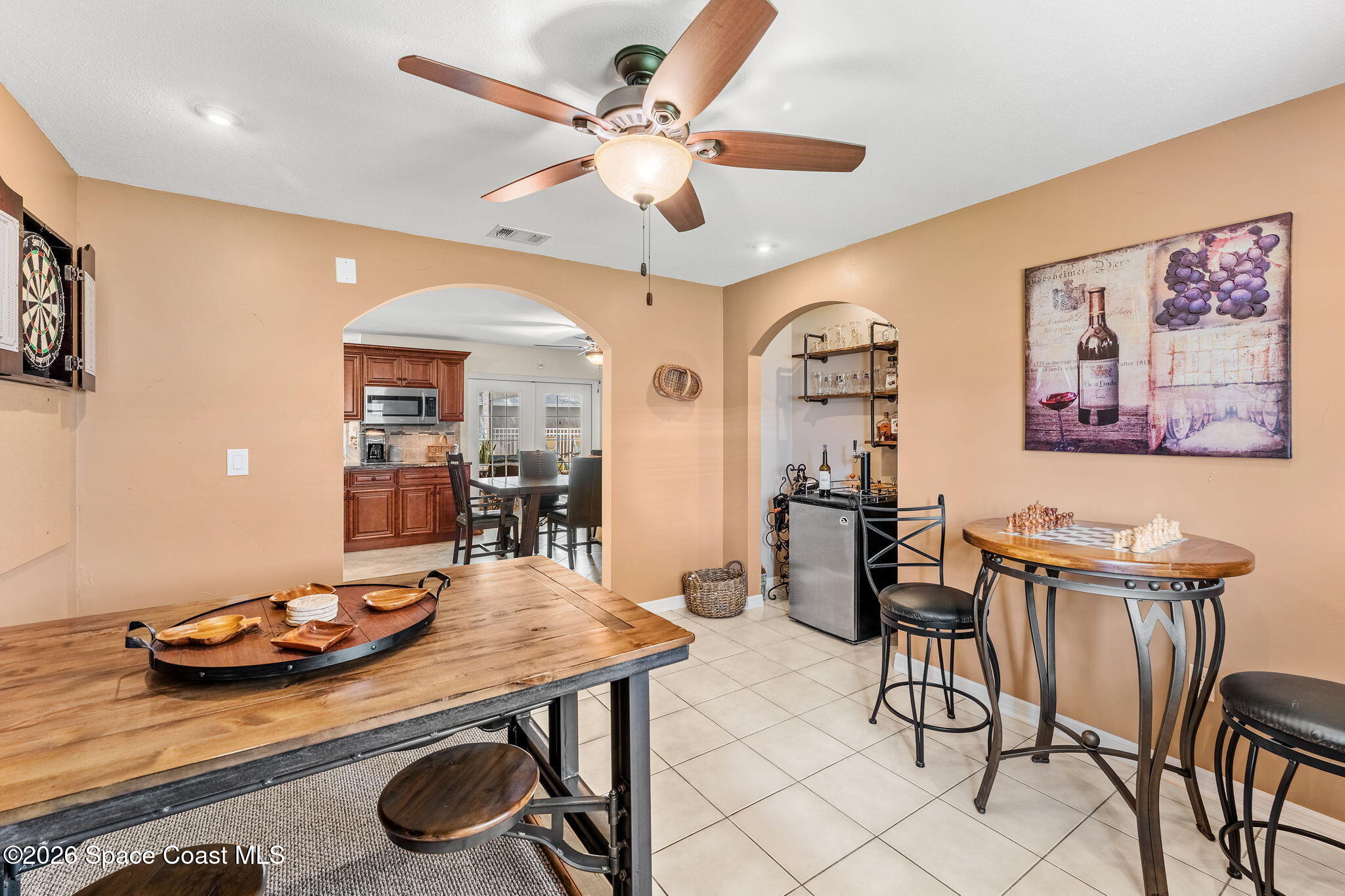31 Fairway Drive Cocoa Beach, FL 32931 - Photo 24 of 53 a living room with furniture and a chandelier