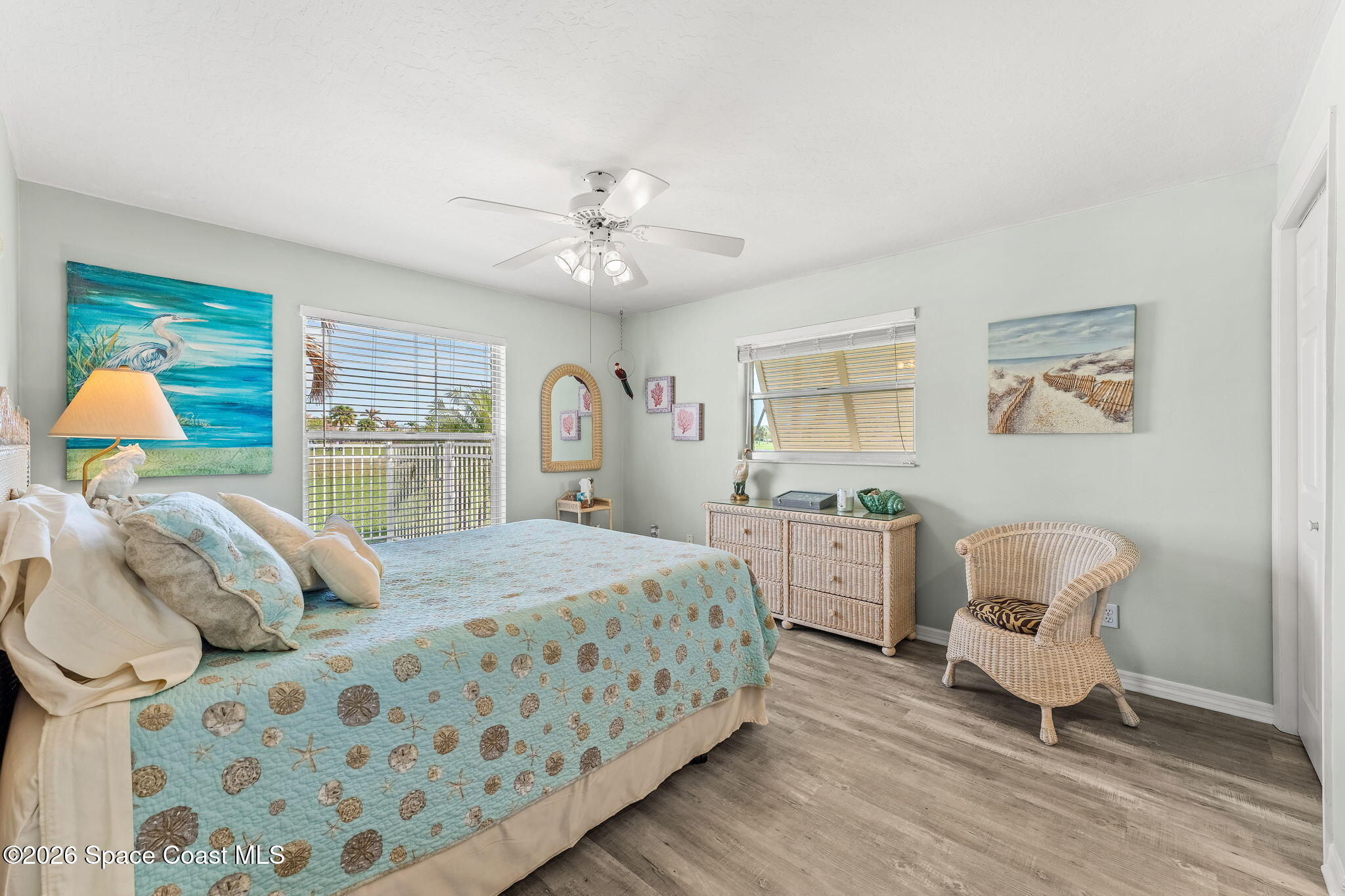 31 Fairway Drive Cocoa Beach, FL 32931 - Photo 29 of 53 a bedroom with a bed and wooden floor