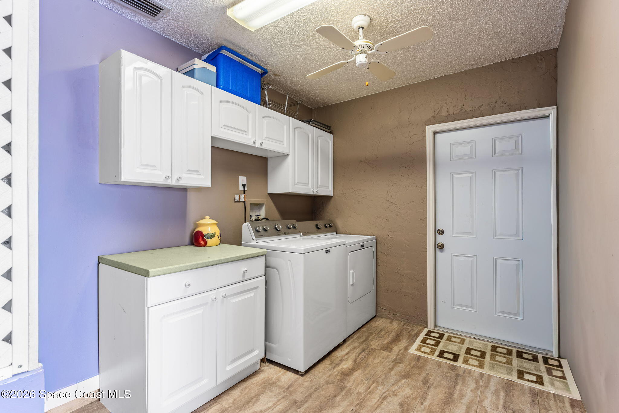 31 Fairway Drive Cocoa Beach, FL 32931 - Photo 33 of 53 a view of storage and utility room with washer and dryer