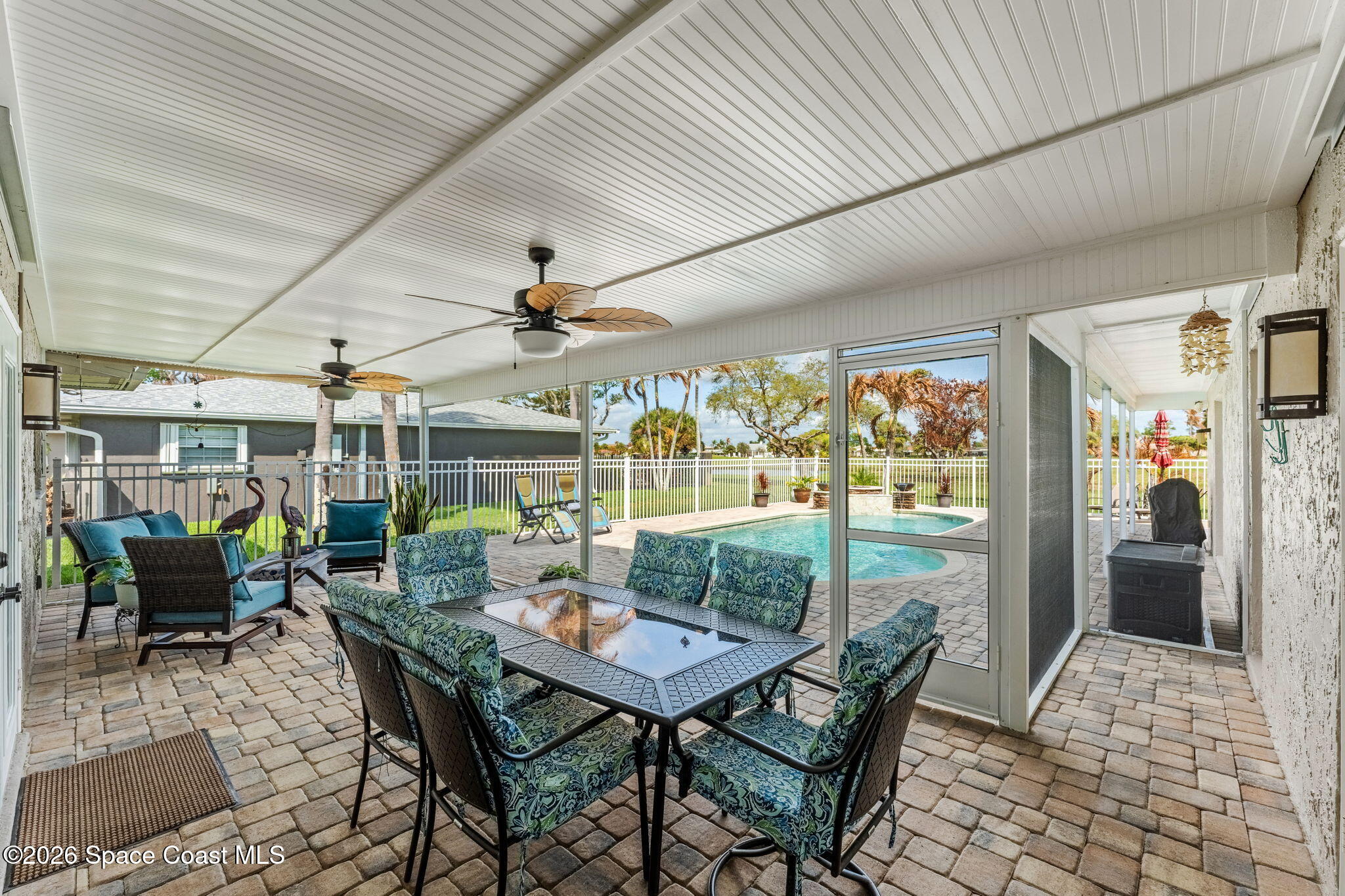 31 Fairway Drive Cocoa Beach, FL 32931 - Photo 34 of 53 a view of a dining room with furniture wooden floor and chandelier