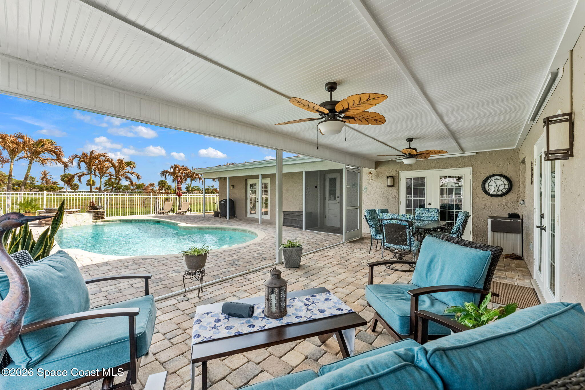 31 Fairway Drive Cocoa Beach, FL 32931 - Photo 36 of 53 a living room with furniture and a flat screen tv
