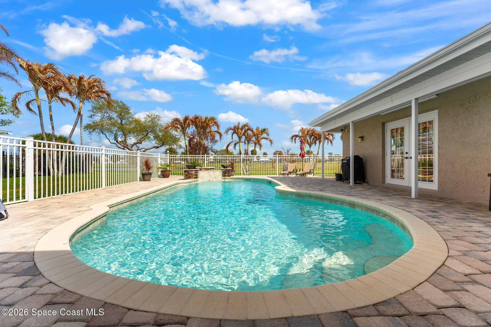 31 Fairway Drive Cocoa Beach, FL 32931 - Photo 37 of 53 a view of a swimming pool with a patio