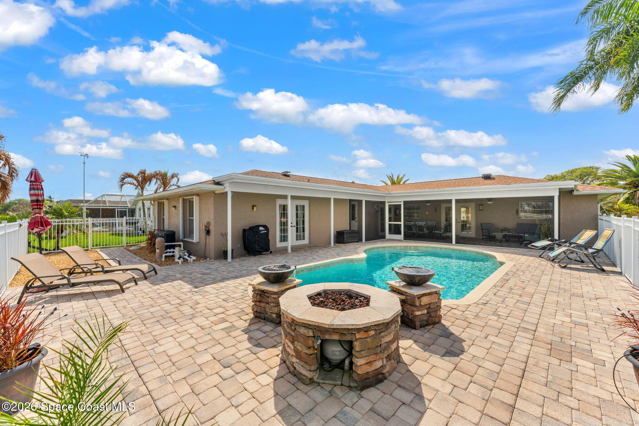 31 Fairway Drive Cocoa Beach, FL 32931 - Photo 38 of 53 a view of a house with backyard sitting area and barbeque oven
