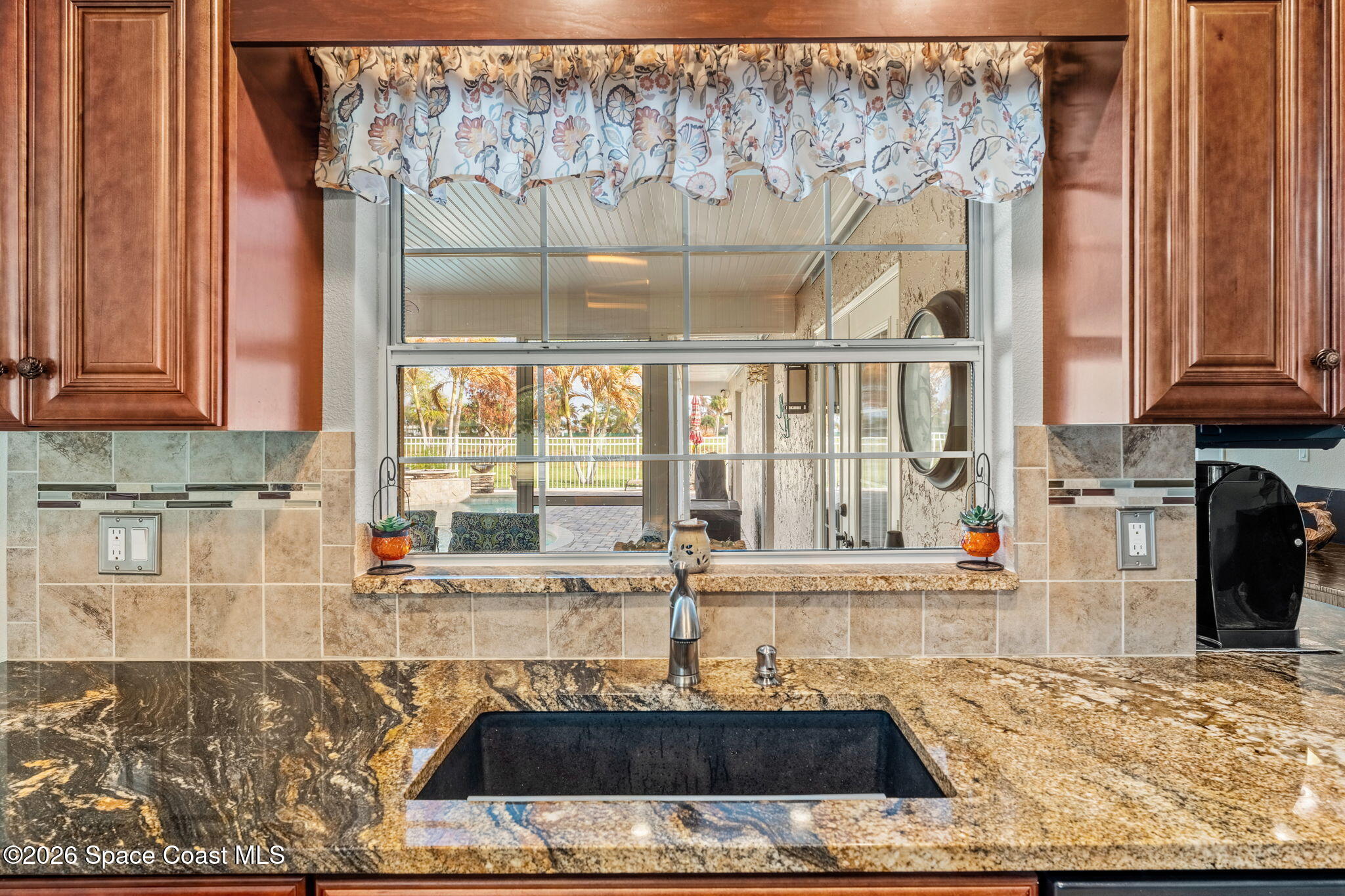 31 Fairway Drive Cocoa Beach, FL 32931 - Photo 4 of 53 a view of a kitchen with a window