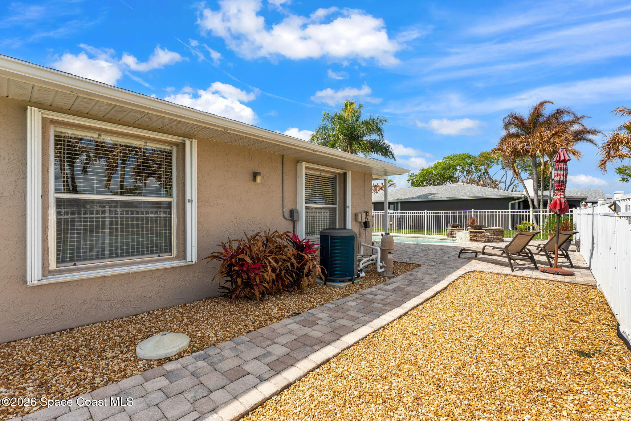 31 Fairway Drive Cocoa Beach, FL 32931 - Photo 42 of 53 a front view of house with a garden
