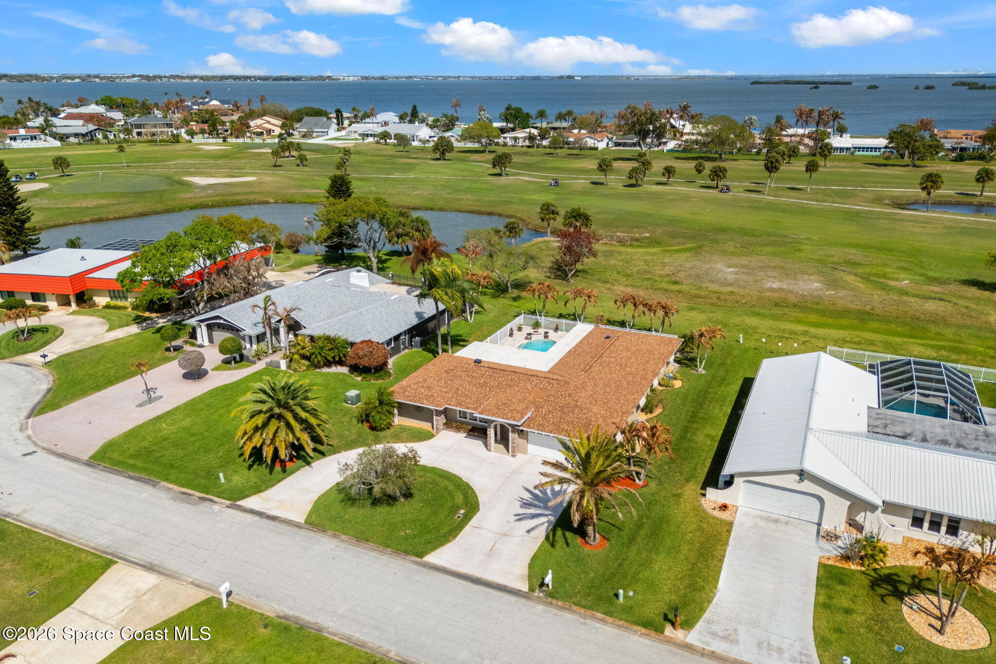 31 Fairway Drive Cocoa Beach, FL 32931 - Photo 50 of 53 an aerial view of a house with outdoor space