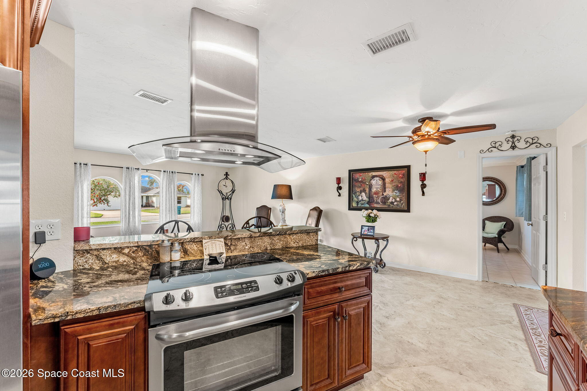 31 Fairway Drive Cocoa Beach, FL 32931 - Photo 5 of 53 a kitchen with stainless steel appliances granite countertop a stove and a sink