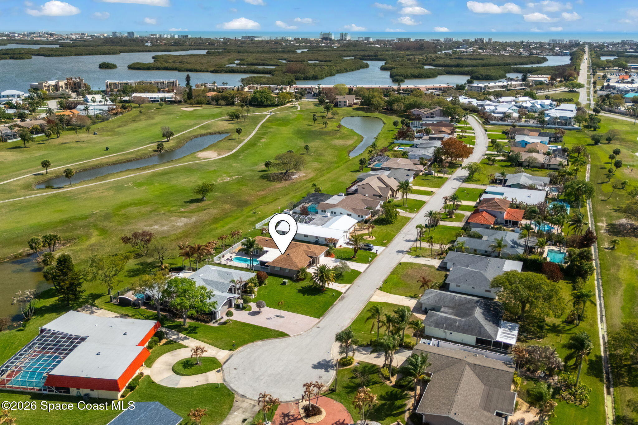 31 Fairway Drive Cocoa Beach, FL 32931 - Photo 51 of 53 an aerial view of a houses with a lake view