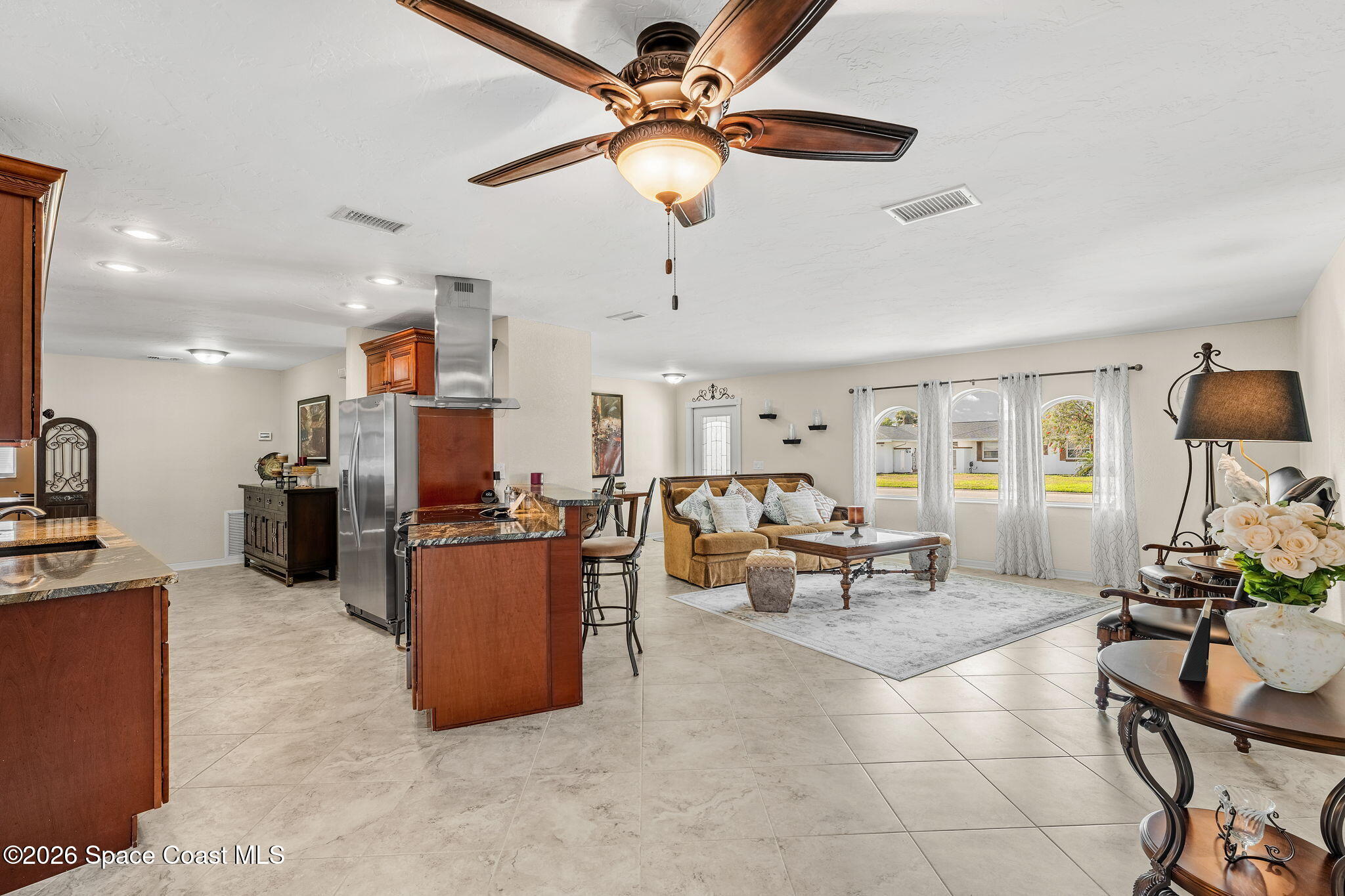 31 Fairway Drive Cocoa Beach, FL 32931 - Photo 7 of 53 a living room with furniture and a ceiling fan