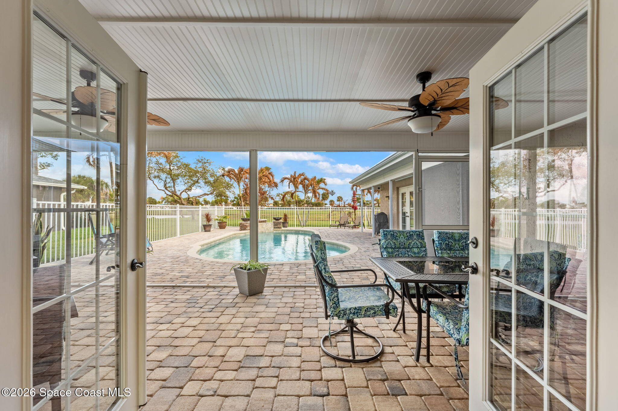 31 Fairway Drive Cocoa Beach, FL 32931 - Photo 9 of 53 a view of a patio with a table and chairs
