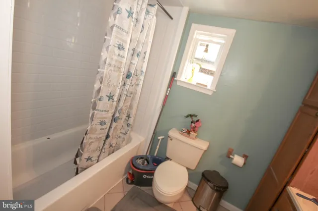 a bathroom with a toilet sink and bathtub