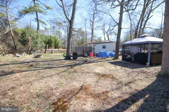 a view of street with trees and houses