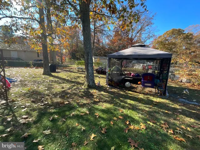 a view of a car park in front of a house