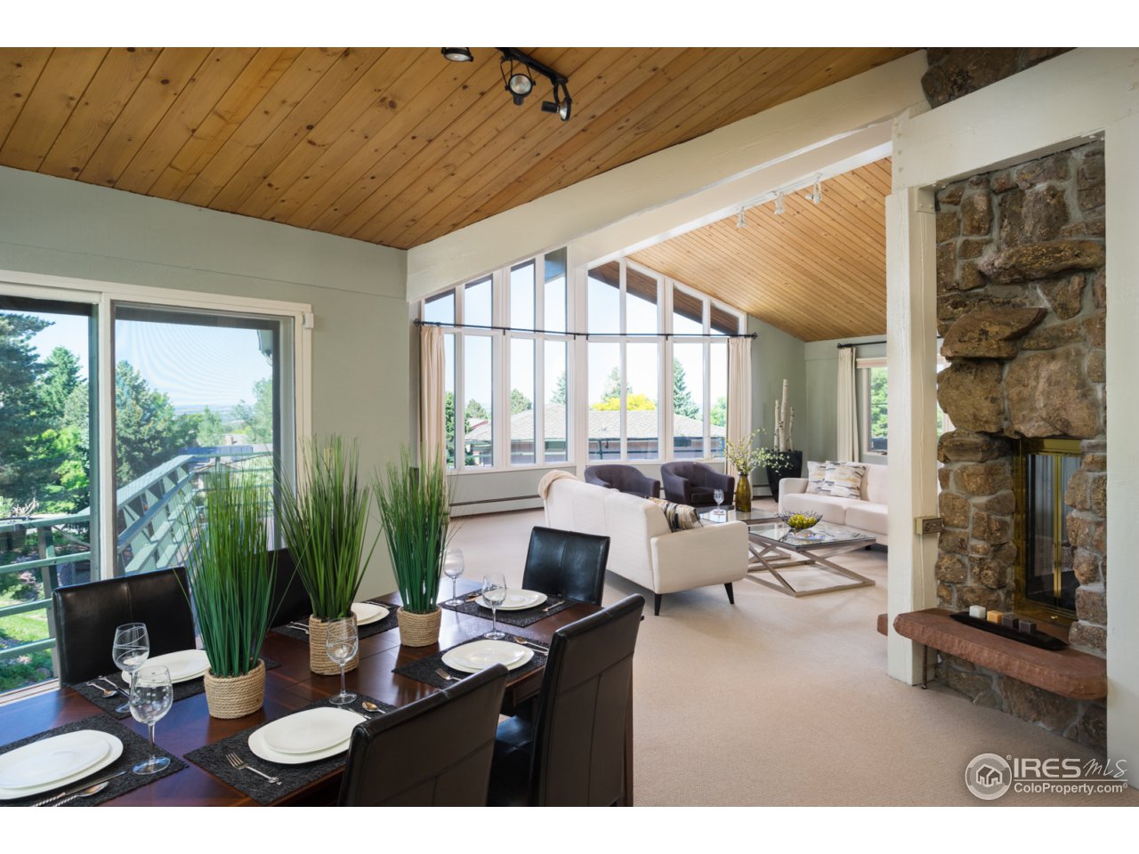 1755 View Point Road Boulder, CO 80305 - Photo 13 of 40 a living room with furniture a large window and a fireplace