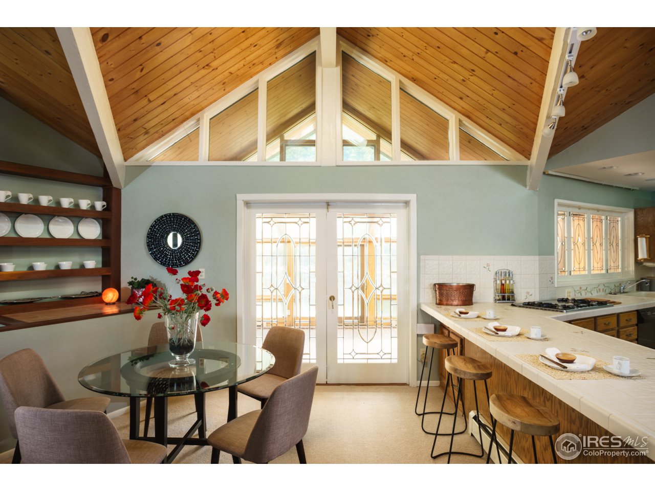 1755 View Point Road Boulder, CO 80305 - Photo 16 of 40 a view of a dining room with furniture and a chandelier