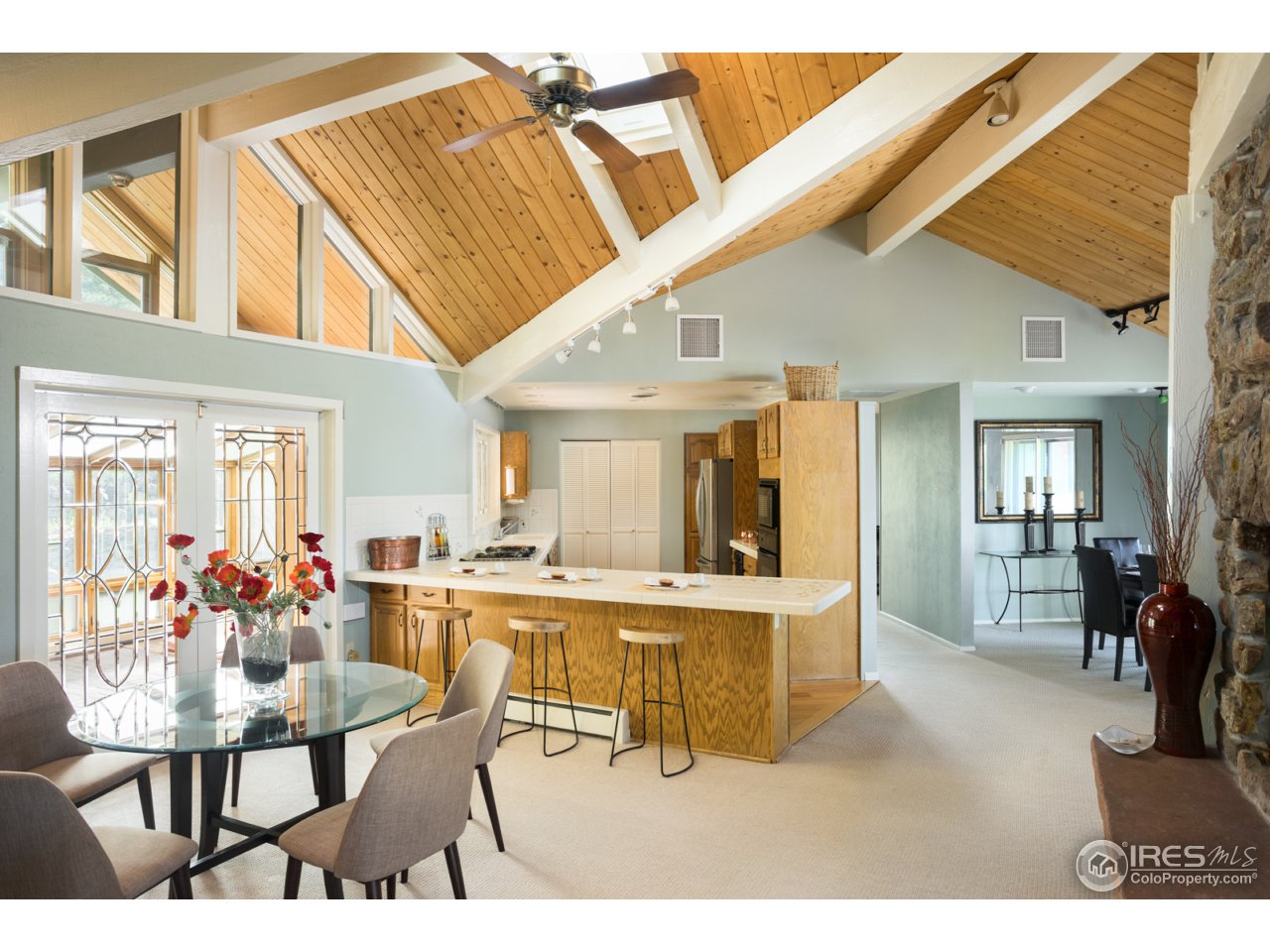 1755 View Point Road Boulder, CO 80305 - Photo 17 of 40 a view of a dining room with furniture and chandelier