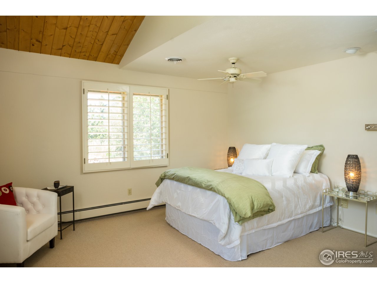 1755 View Point Road Boulder, CO 80305 - Photo 23 of 40 a bedroom with a bed lamp and a dresser