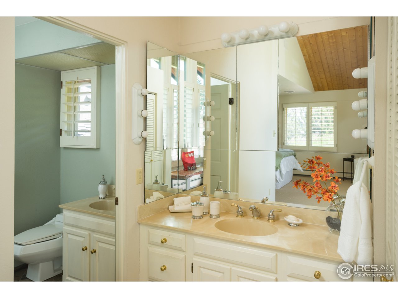 1755 View Point Road Boulder, CO 80305 - Photo 24 of 40 a bathroom with a sink vanity mirror and toilet