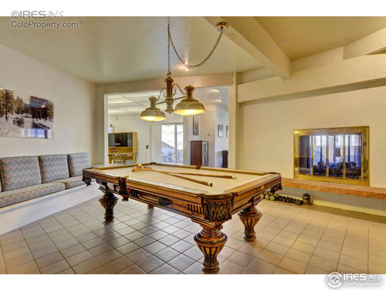 1755 View Point Road Boulder, CO 80305 - Photo 26 of 40 a living room with a table tennis table and a couch