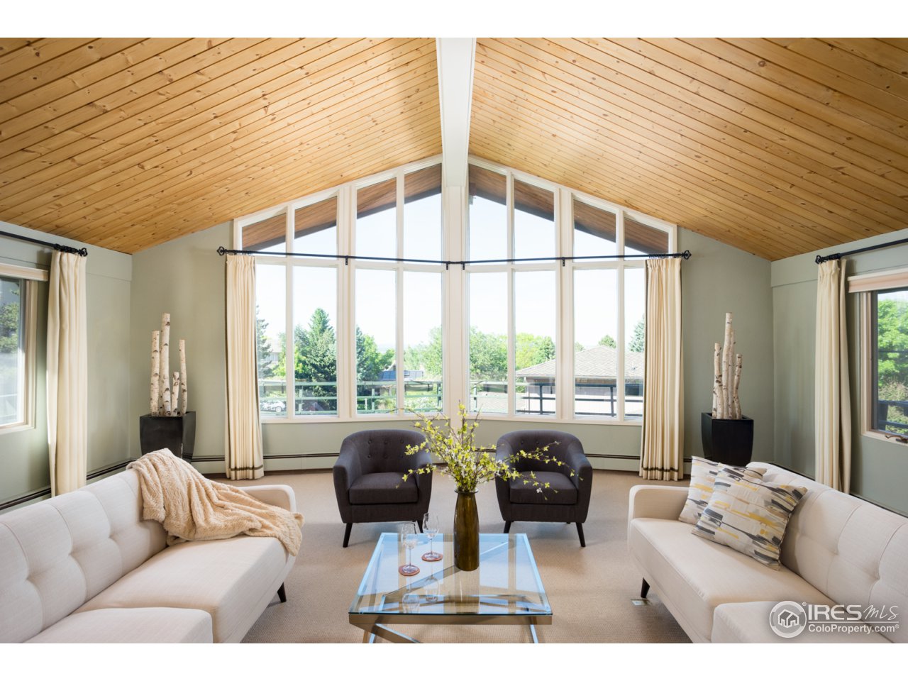 1755 View Point Road Boulder, CO 80305 - Photo 5 of 40 a living room with furniture large windows and wooden floor