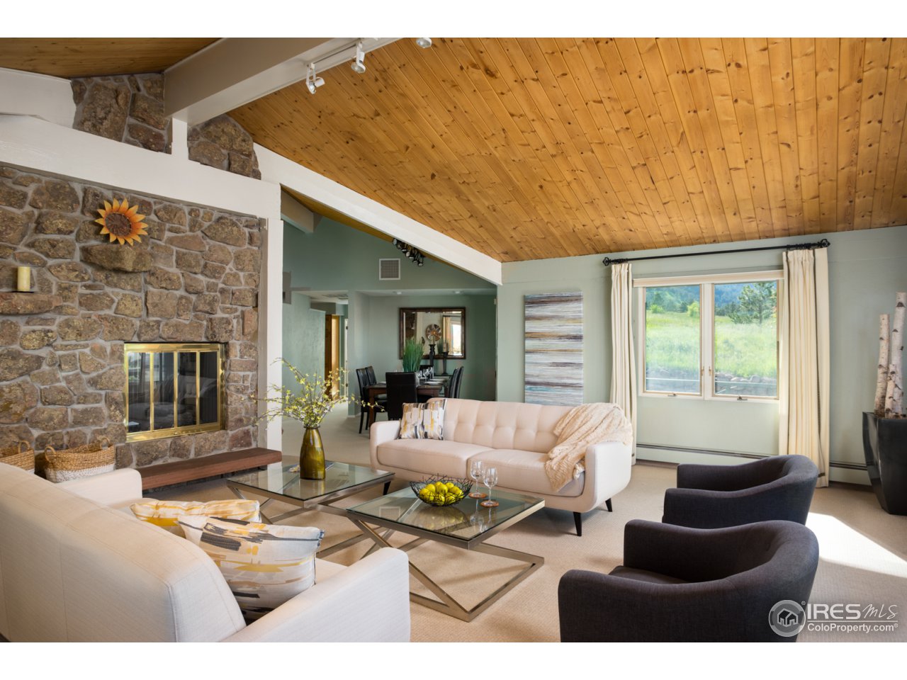 1755 View Point Road Boulder, CO 80305 - Photo 8 of 40 a living room with furniture and a fireplace