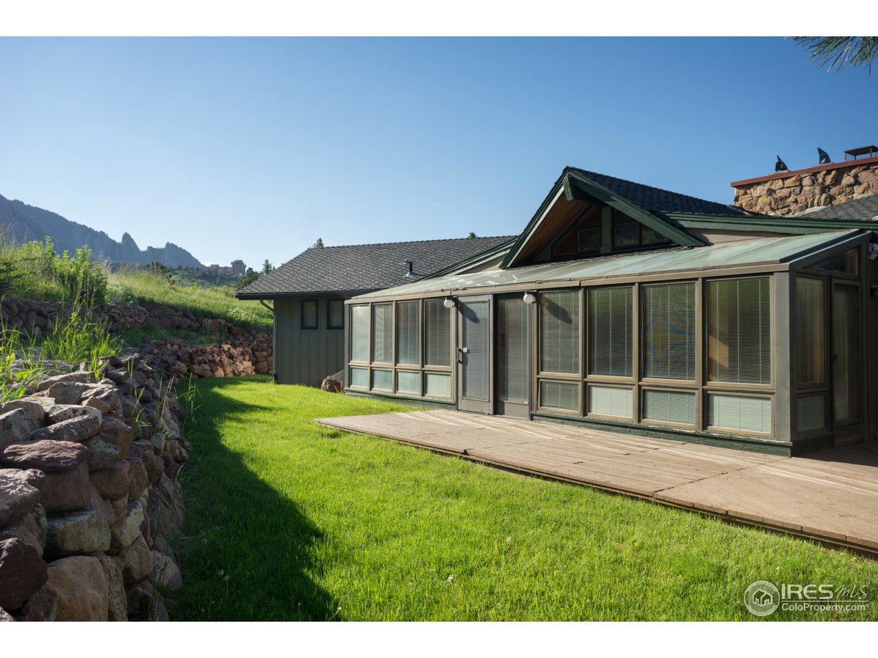 1755 View Point Road Boulder, CO 80305 - Photo 9 of 40 a house with green field in front of it