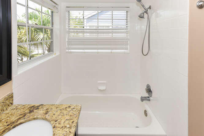 5359 Buckhead Circle Boca Raton, FL 33431 - Photo 17 of 27 a bathroom with a bath tub with a shower