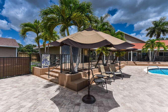 5359 Buckhead Circle Boca Raton, FL 33431 - Photo 23 of 27 a view of a house with swimming pool and sitting area
