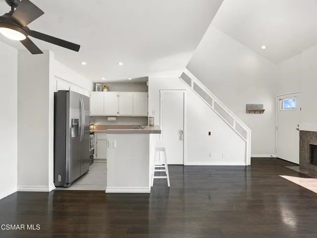 a view of a kitchen with wooden floor