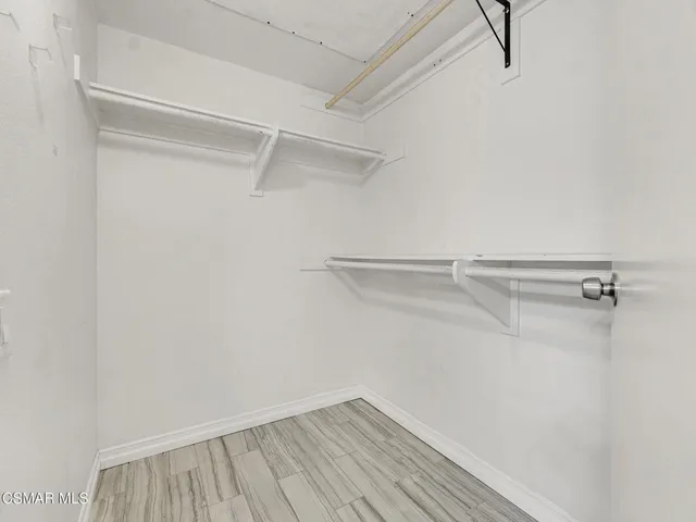 a view of a room with racks on the wall