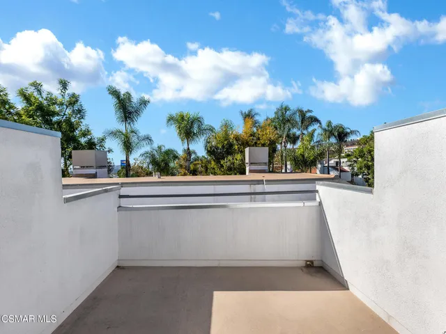 a view of a kitchen with a large tree