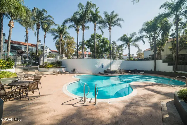 a view of a swimming pool with a patio