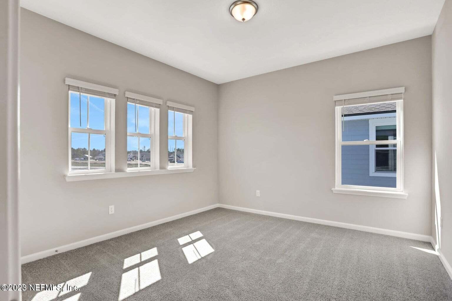 65 Torres Trace Street St. Augustine, FL 32095 - Photo 11 of 32 a view of an empty room with a window