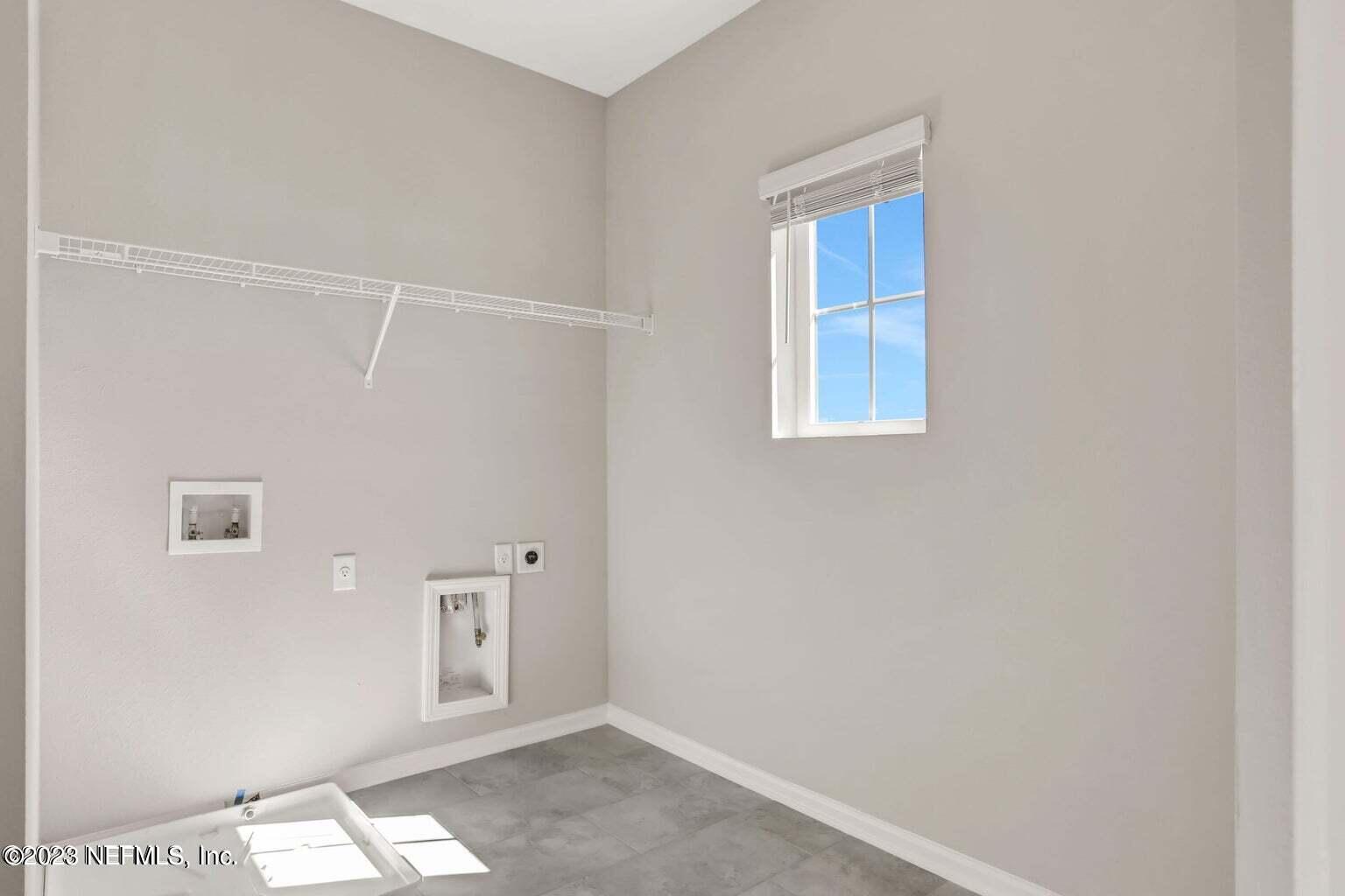 65 Torres Trace Street St. Augustine, FL 32095 - Photo 12 of 32 a view of an empty room with windows