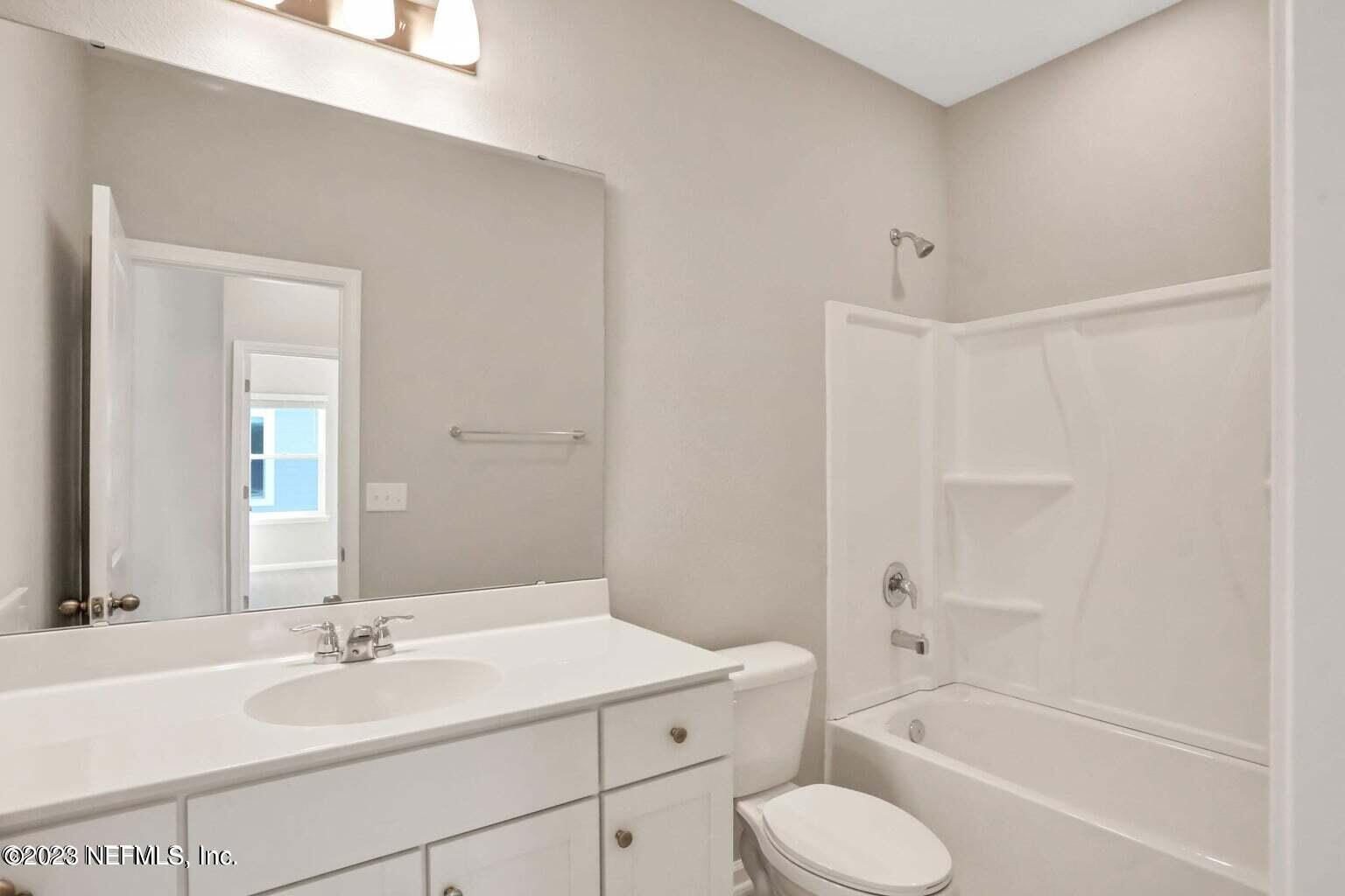 65 Torres Trace Street St. Augustine, FL 32095 - Photo 13 of 32 a bathroom with a sink toilet and shower