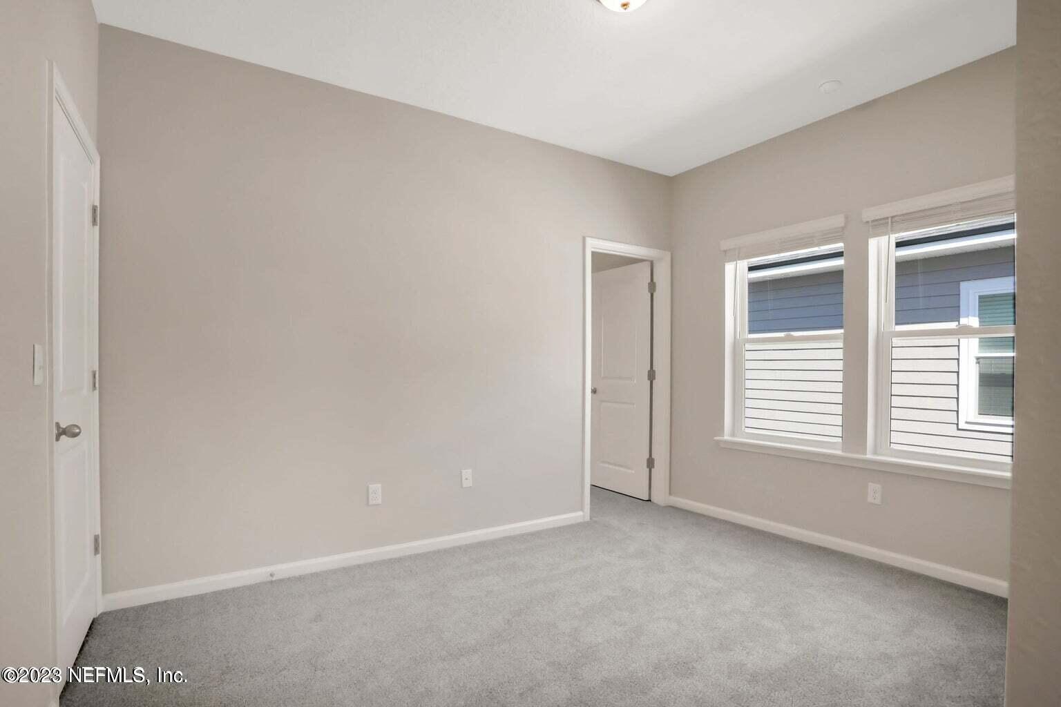 65 Torres Trace Street St. Augustine, FL 32095 - Photo 14 of 32 a view of an empty room with a window