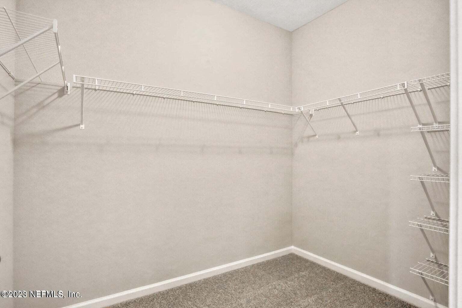 65 Torres Trace Street St. Augustine, FL 32095 - Photo 15 of 32 a view of a room with racks on the wall