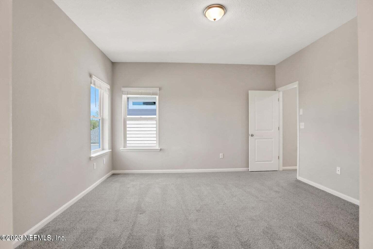 65 Torres Trace Street St. Augustine, FL 32095 - Photo 19 of 32 a view of an empty room with a window