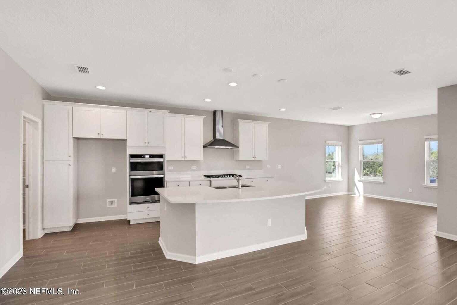 65 Torres Trace Street St. Augustine, FL 32095 - Photo 8 of 32 a kitchen with stainless steel appliances a sink and a refrigerator