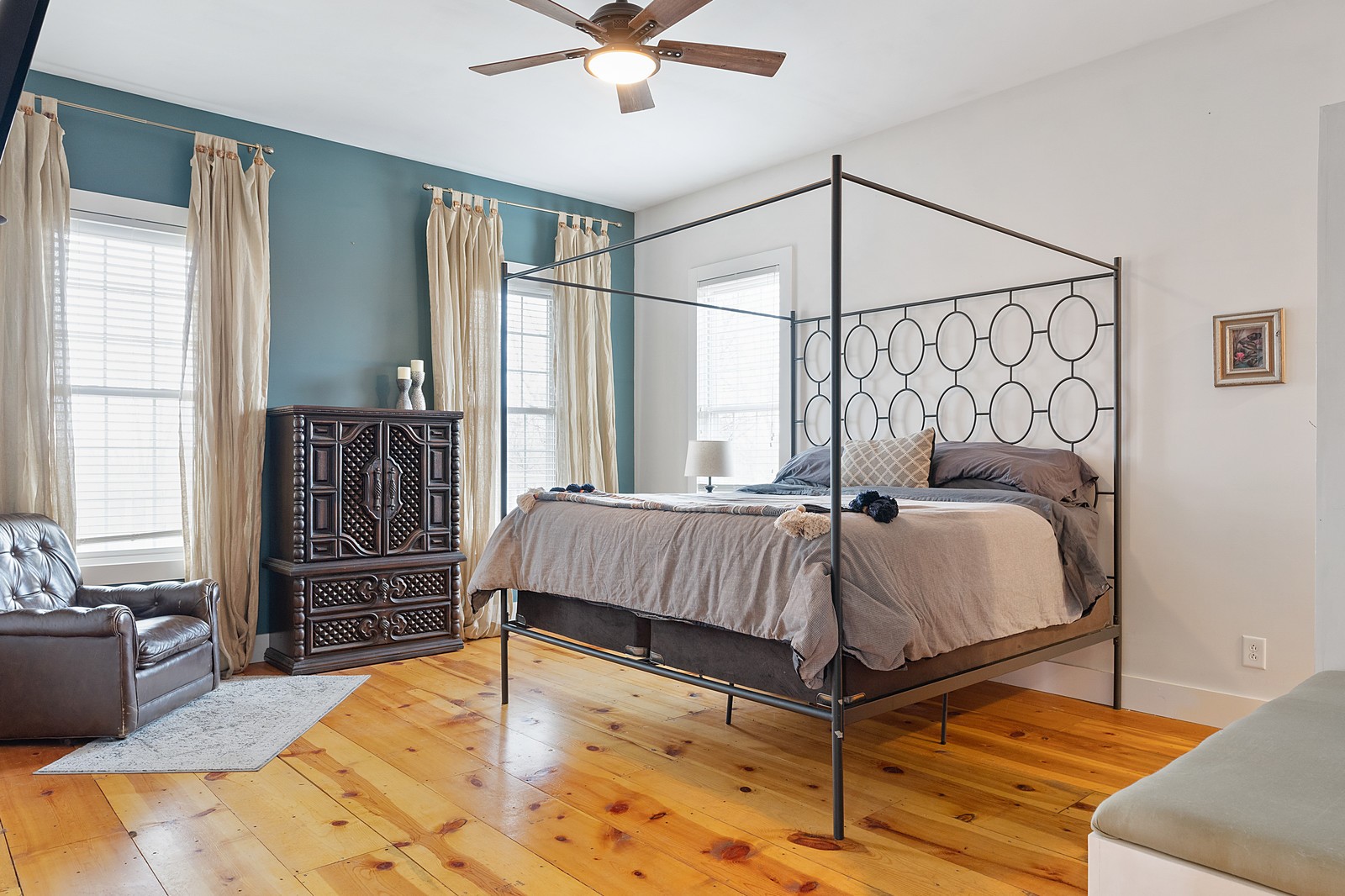 3073 Mooneyhan Road Springfield, TN 37172 - Photo 14 of 24 a bedroom with a bed and dresser with wooden floor